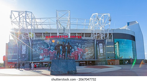 MANCHESTER, UNITED KINGDOM -21-10 2021: The Old Trafford stadium with wam sunlight taken during sunset. Old Trafford is the home stadium of Manchester United Football Club since 1910.