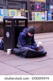 Manchester, United Kingdom - 5th March 2021: Homeless man begging in city centre Manchester.