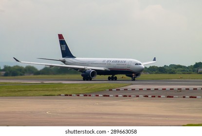 Manchester, United Kingdom - June 14, 2014: US Airways Airbus A330 Taking Off From Manchester Airport. At May 2015, American Airlines Moved US Airways Flight Attendant Training To Fort Worth, FL.