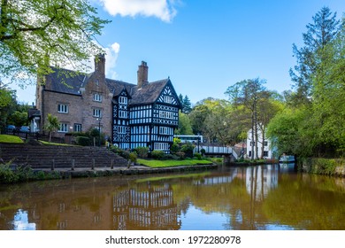 MANCHESTER, UNITED KINGDOM - May 05, 2021: Tudor Houses Circa 1800's, Wooden And Brick Construction Next To Bridgewater Canal Worsley UK