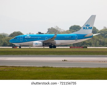 Manchester, United Kingdom - May 11, 2017: Royal Dutch Airlines KLM Boeing 737-7K2 passenger plane (PH-BGE, "The Flying Dutchman") taking off from Manchester International Airport runway.