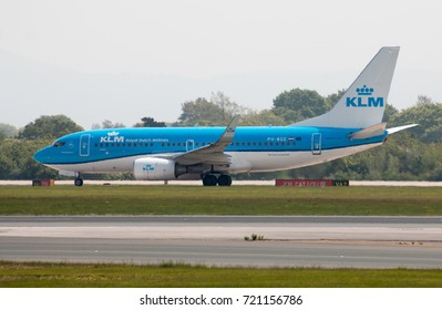 Manchester, United Kingdom - May 11, 2017: Royal Dutch Airlines KLM Boeing 737-7K2 passenger plane (PH-BGE, "The Flying Dutchman") taking off from Manchester International Airport runway.