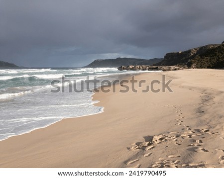 Mandalay Beach in Western Australia in a morning with stormy sky. Place for quiet romantic walk on empty beach.