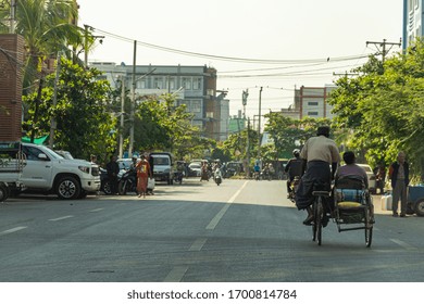 MANDALAY,MYANMAR-DECEMBER 6,2019: Unidentified Burmese Male Ride Motorcycle With Sidecar On Empty Road On December 6,2019 In Mandalay Myanmar