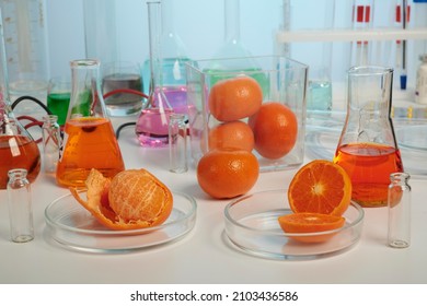 Mandarin orange juice testing in a food control laboratory. Investigation of fake mandarin and orange juice production. Photo from food control laboratory. Mandarin and orange control in test lab - Shutterstock ID 2103436586