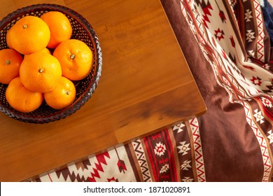 Mandarin oranges placed on the kotatsu - Shutterstock ID 1871020891