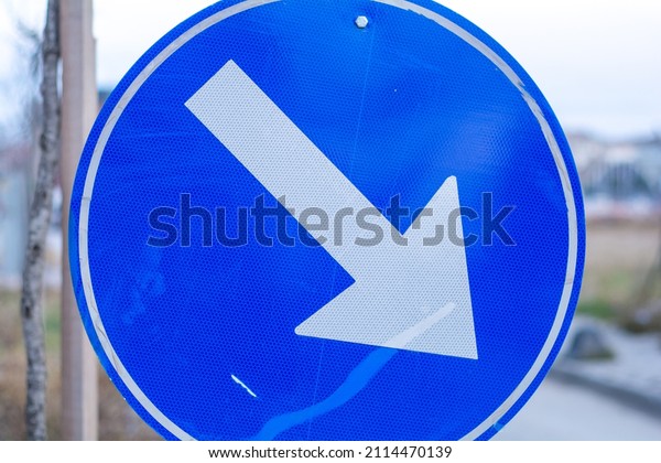 Mandatory
way traffic sign. Blue urban information. Metal regulation. White
arrow transportation shape. City route
sign.