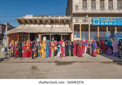 MANDAWA - DEC 22: People Standing In Long Queue In Front Of Bank On 22 December 2016 In Mandawa, India. Demonetization Of Indian 500 And 1000 Rupee Notes Caused Long Queues All Over India. 