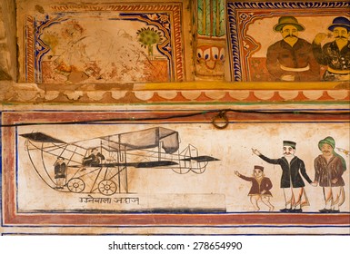 MANDAWA, INDIA - FEB 7: People Happy To See The First Flying Machine On Fresco In Shekhawati Art Style On February 7, 2015. With Pop. Of 21000, Mandawa Is Touristic Site With Naive Art Haveli Mansions