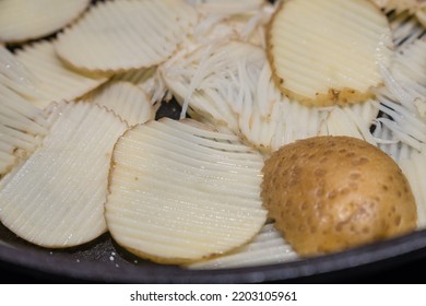 Mandolin Slicing Raw Potato In Home Kitchen.