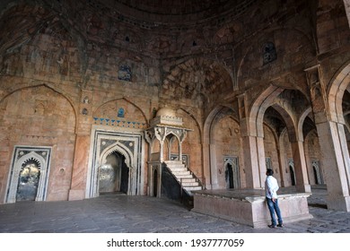 Mandu, India - March 2021: A tourist visiting the Jama Masjid, a historic mosque built in Moghul style of architecture on March 14, 2021 in Mandu, Madhya Pradesh, India.