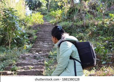 Mangan, Sikkim, India- December 23 2020: Young Woman Traveler Resting On The Way At Mountain Hiking