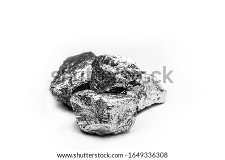 Manganese, manganese, or magnesium stone is a chemical element, it is in the manufacture of metal alloys. Silver colored ore, industrial use. Ore on black isolated background.