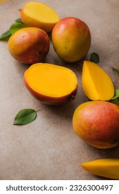 Mango background design concept. Top view of  fresh mango fruit pattern with leaves on  table.