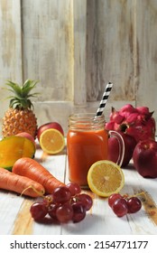 Mango And Carrot Juice. Color Juice. Mixed Juice. Made From Mango, Apple, Guava, Carrot, Pineapple And Orange. Served In A Glass. Selective Focus