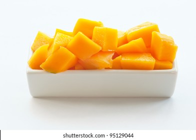 Mango Cubes On A White Dish