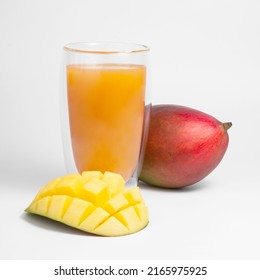 Mango fruit juice in glass isolated on the white