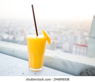 Mango Juice With Tube In The Glass