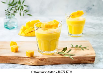 Mango Lassi, Yogurt Or Smoothie With Turmeric. Healthy Probiotic Indian Cold Summer Drink 