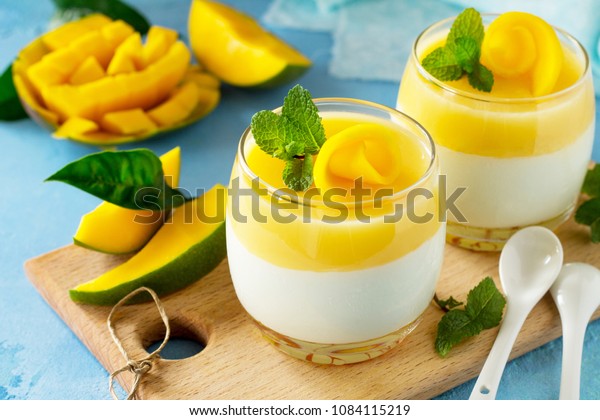 Mango Panna cotta with mango jelly and mint,\
Italian dessert, homemade\
cuisine.