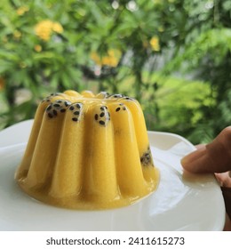 Mango pudding with chiaseed on the white plate.
