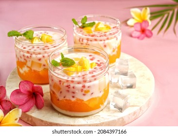 Mango Sago is a refreshing and satisfying summer dessert, with juicy chunks of mango and a mango, tapioca pearl and mango pudding in a milk or coconut milk infused creamy.