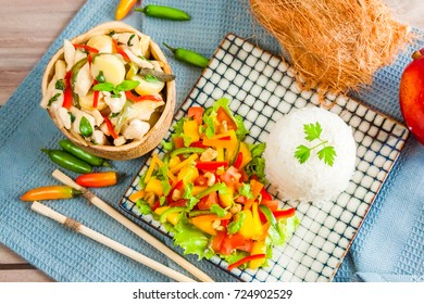 Mango salad served with thai green curry and rice