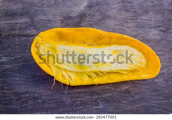 Mango seed on wood