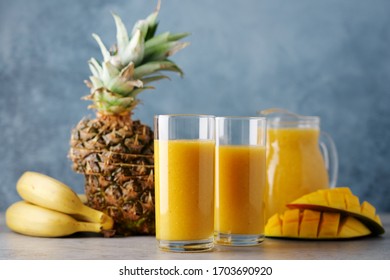 Mango Smoothie With Pineapple And Banana In Glasses. Fresh Breakfast, Detox Drink