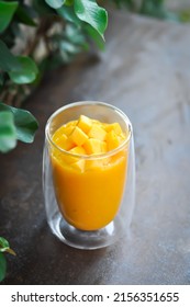 mango smoothie or mango yogurt smoothie , blended mango for serve - Shutterstock ID 2156351655