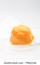 Mango Sorbet In A Glass Bowl On A White Background Isolated