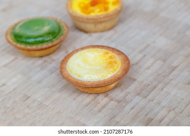 Mango Tart, Egg Tart And Steamed Custard Tart On A Wood With Copy Space.