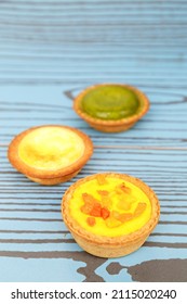 Mango Tart, Egg Tart And Steamed Custard Tart On A Wood With Copy Space.