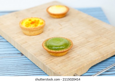 Mango Tart, Egg Tart And Steamed Custard Tart On A Wood With Copy Space.