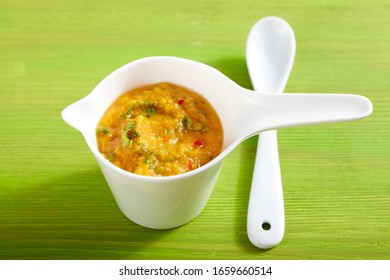 Mango Tomato Salsa On Green Wood