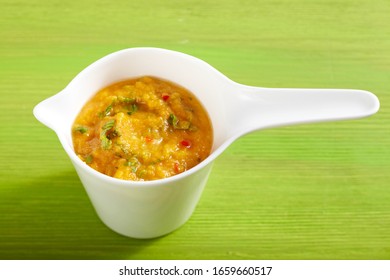 Mango Tomato Salsa On Green Wood