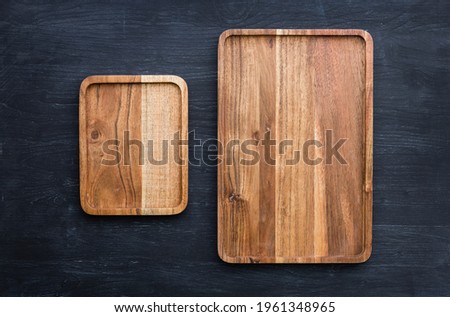 Mango tree wooden kitchen board. Perfect place to cut meat. Place for the dish. Beautiful painted dark navy blue background.
Food advertising. Pictures of dishes in the restaurant. Wooden serving tray