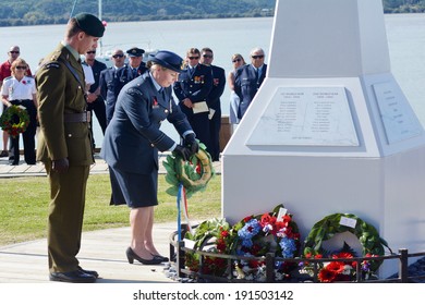 MANGONUI, NEW ZEALAND - APRIL 25 2014:New Zealand Army Officers Placing Flower Wreaths On Mangonui War Memorial During Anzac Day War Memorial Service.