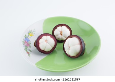 Mangosteen Fruits,in A Plate,see Inside, Placed On A White Background.