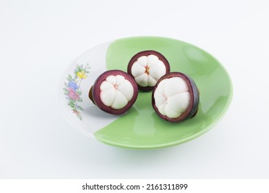 Mangosteen Fruits,in A Plate,see Inside, Placed On A White Background.