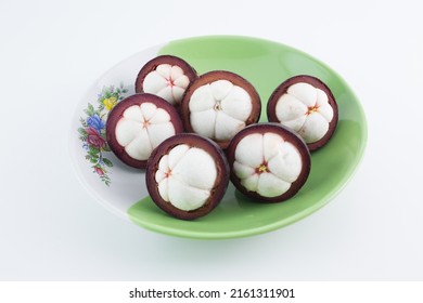 Mangosteen Fruits,in A Plate,see Inside, Placed On A White Background.