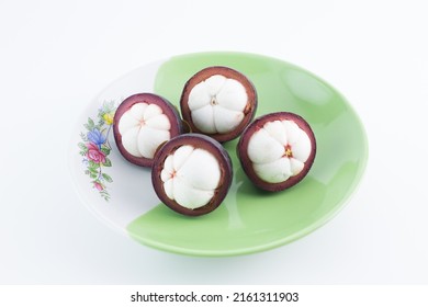 Mangosteen Fruits,in A Plate,see Inside, Placed On A White Background.