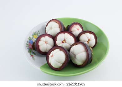 Mangosteen Fruits,in A Plate,see Inside, Placed On A White Background.