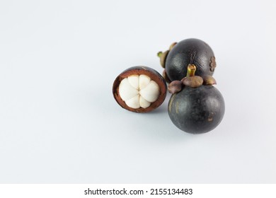  Mangosteen Fruits,see Inside, Placed On A White Background.