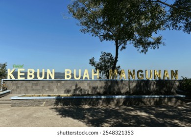 Mangunan Fruit Garden (Kebun Buah Mangunan), Yogyakarta, Indonesia. Beautiful views of nature and hills from a height. Translate : The top of the Mangunan fruit garden. - Powered by Shutterstock