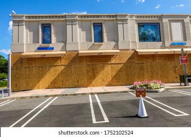 MANHASSET, NEW YORK - JUNE 7, 2020: Hermes Store Boards Up And Covers Store Name As A Precaution To Prevent Looting Of The Store In Americana Manhasset Luxury Shopping Mall