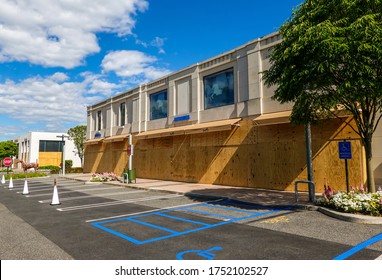 MANHASSET, NEW YORK - JUNE 7, 2020: Hermes Store Boards Up And Covers Store Name As A Precaution To Prevent Looting Of The Store In Americana Manhasset Luxury Shopping Mall