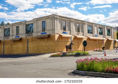 MANHASSET, NEW YORK - JUNE 7, 2020: Hermes Store Boards Up And Covers Store Name As A Precaution To Prevent Looting Of The Store In Americana Manhasset Luxury Shopping Mall