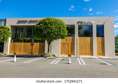 MANHASSET, NEW YORK - JUNE 7, 2020: Prada And Giorgio Armani Stores Board Up As A Precaution To Prevent Looting Of The Store In Americana Manhasset Luxury Shopping Mall