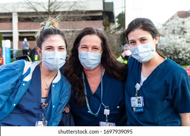 Manhasset, NY - April 7, 2020: Nurses pose during Nassau County first responders line up to salute heroes from front lines of COVID-19 pandemic at North Shore University Hospital